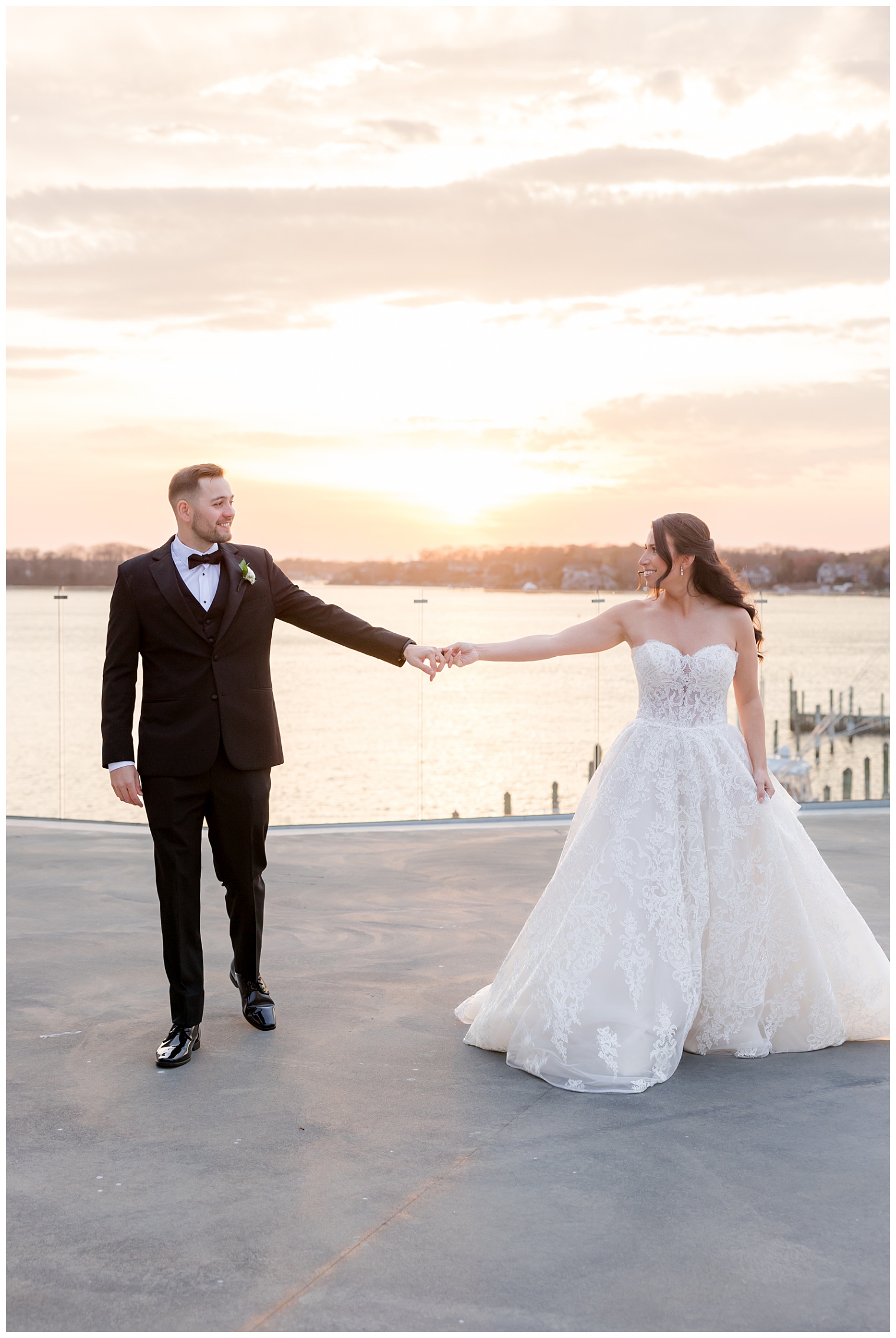bride and groom holding hands