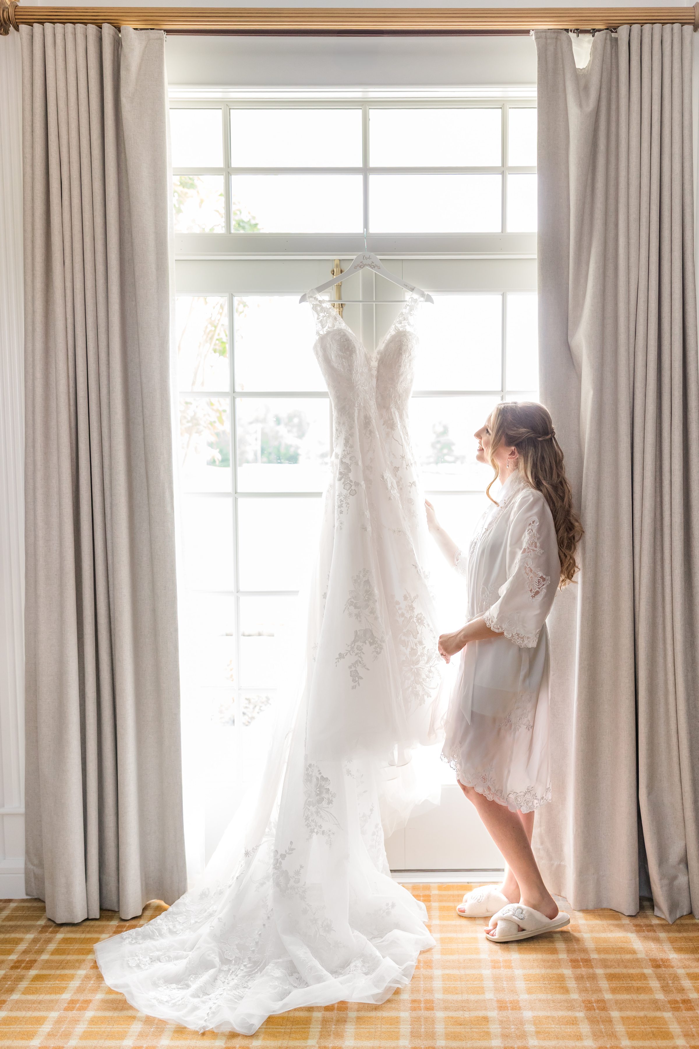 Bride looking at wedding dress shot