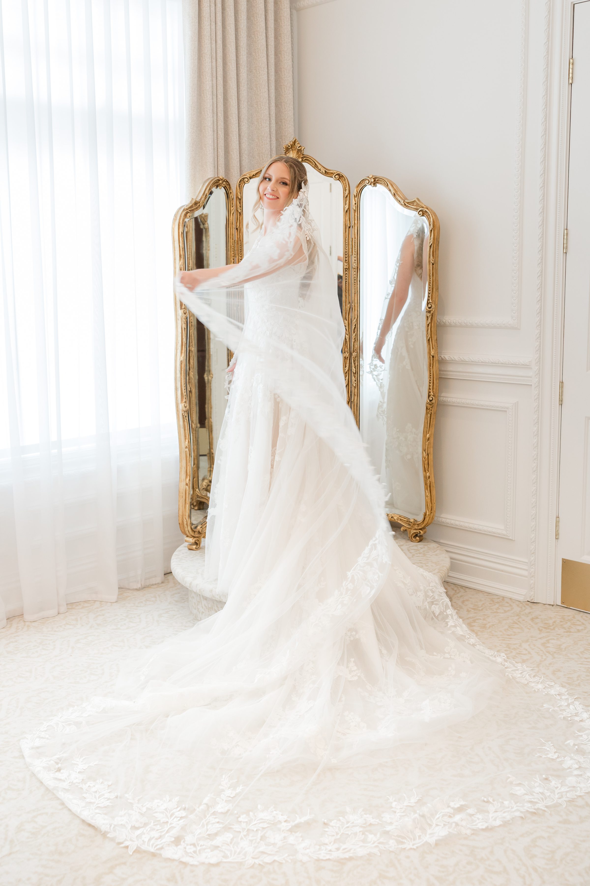 Bride twirling her veil