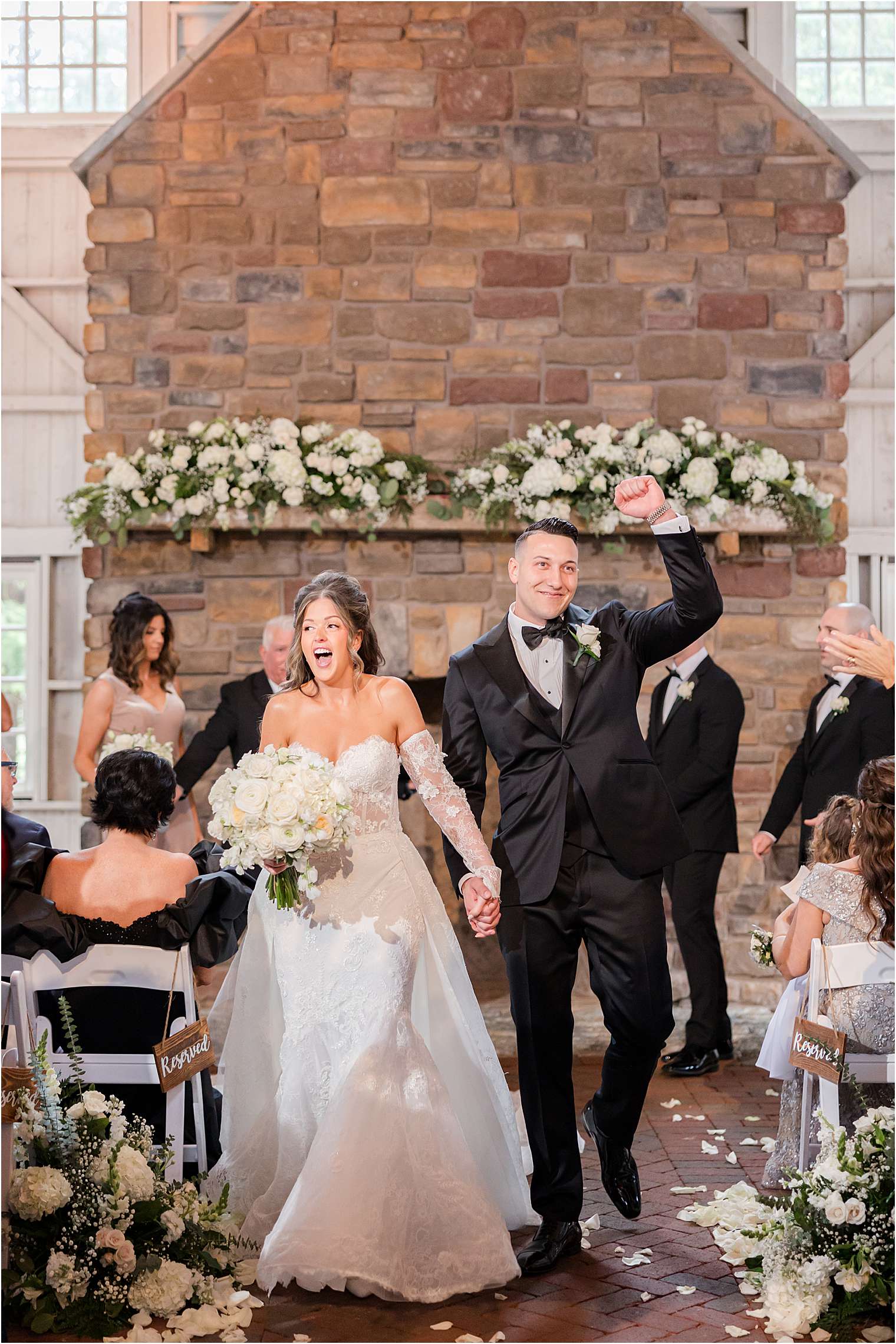 bride and groom recessional after barn ceremony at Ashford Estate in Allentown NJ